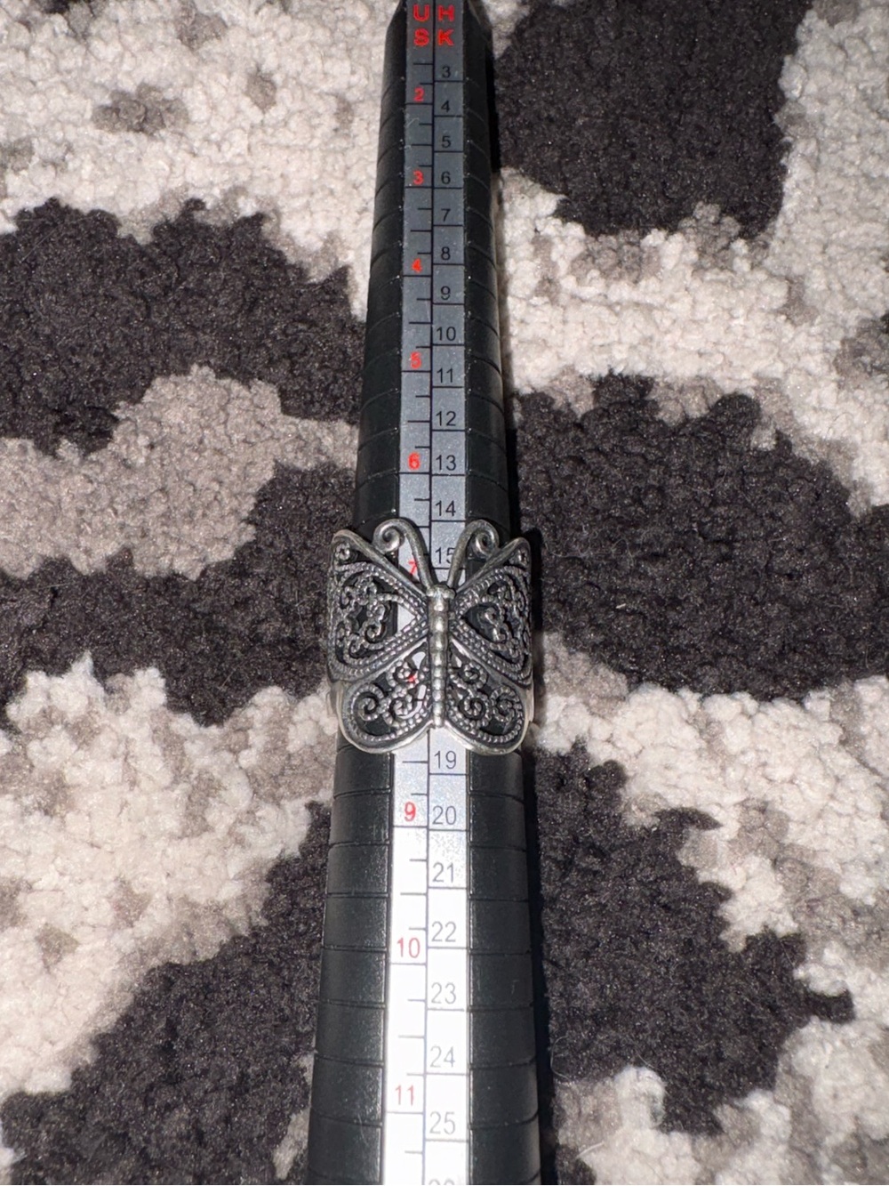 Silver butterfly ring.